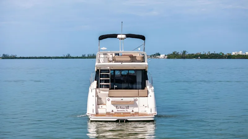 Slide: The Image of Aft View with Flybridge This image showcases the elegant aft view of the 2018 Sea Ray 400 Fly, Tee Time III. The flybridge offers ample seating and a commanding view, perfect for leisurely cruising. The open layout and sleek design emphasize luxury and functionality, making it a - 7762732