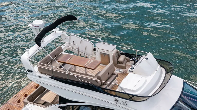 Slide: The Image of Spacious Flybridge with Seating The flybridge of the 2018 Sea Ray 400 Fly, Tee Time III, features ample seating for relaxation and socializing. The area is equipped with a sleek helm station and a comfortable dining arrangement, perfect for enjoying panoramic views. Premium finishes and - 7762727