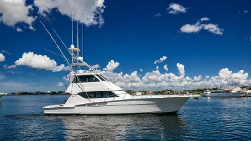 Slide: The Image of Starboard View of Enclosed Bridge This image showcases the sleek design of the Hatteras 60 Enclosed Bridge Convertible, highlighting its classic profile and robust structure. The enclosed bridge offers excellent visibility and protection from the elements, making it ideal for long voyages - 7956996