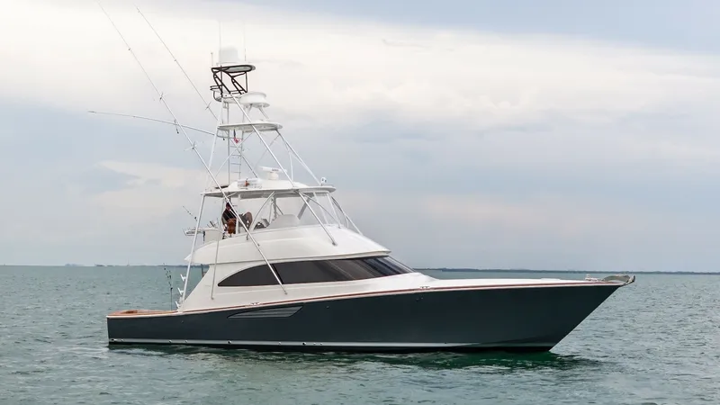 The Image of Starboard Exterior View of Viking 55 This striking image showcases the sleek exterior of the 2015 Viking 55 Convertible 'Rosita'. The vessel features a distinctive tower, enhancing its fishing capabilities, and a sophisticated dark hull that contrasts beautifully with the white superstructur - 7584843