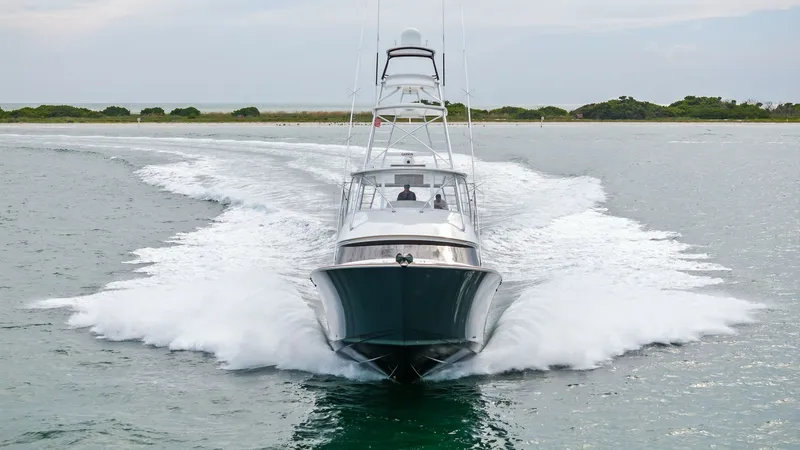 Slide: The Image of Viking 55 Convertible Bow View Experience the sleek design and powerful presence of the Viking 55 Convertible as it glides through the water. The striking bow cuts through the waves with ease, showcasing the vessel's remarkable engineering and performance capabilities. This view highli - 7584946