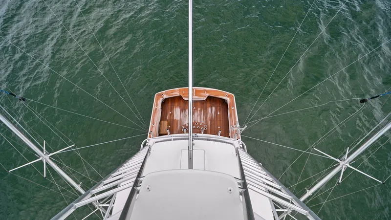 Slide: The Image of Aerial View of Cockpit and Deck This striking aerial view of the 2015 Viking 55 Convertible's cockpit highlights the spacious teak deck ideal for fishing or relaxation. The clean lines and sturdy design showcase Viking's commitment to craftsmanship and performance. Perfect for anglers a - 7584913