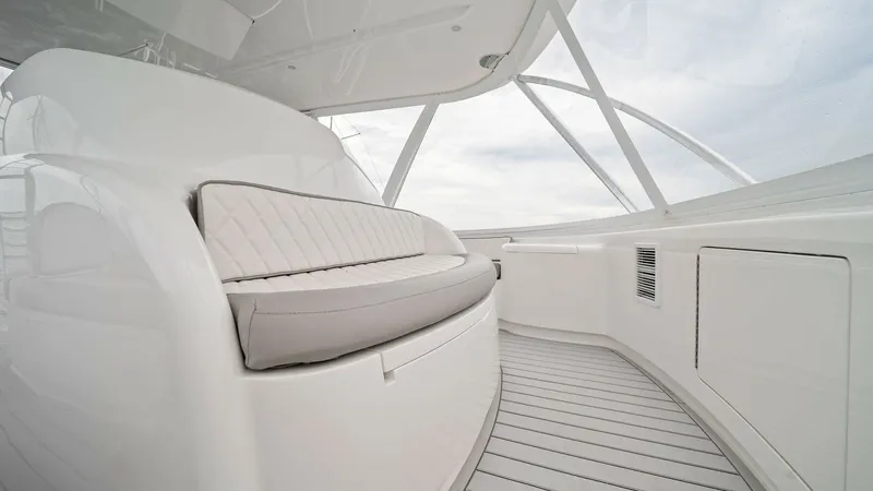 Slide: The Image of Flybridge Seating Area Experience the comfort of the flybridge seating area on the 2015 Viking 55 Convertible. This space features plush, diamond-stitched upholstery and a sleek, modern design that provides both style and functionality. The expansive views and ample seating mak - 7584901