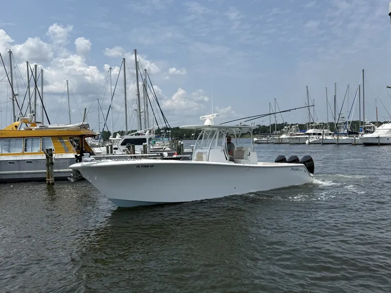 Slide: The Image of 2022 Front Runner 33 CC Profile View Port side profile view showing clean gelcoat finish, hardtop clearance, and heavy-duty rub rail. - 7589626