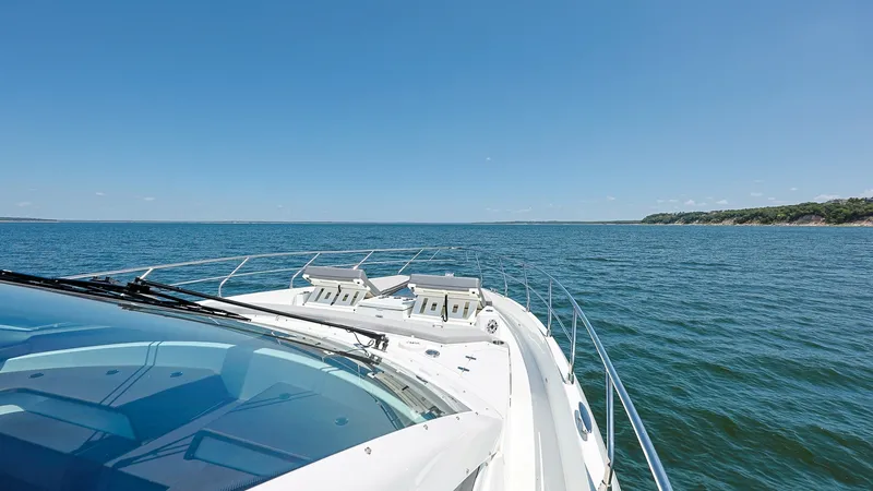 Slide: The Image of Foredeck with Sun Loungers The foredeck of the 2020 Sol Mate 60 Cantius features sleek and stylish sun loungers, perfect for soaking up the sun while enjoying panoramic ocean views. The clean lines and polished rails enhance the modern aesthetic, while the spacious layout offers am - 7661176