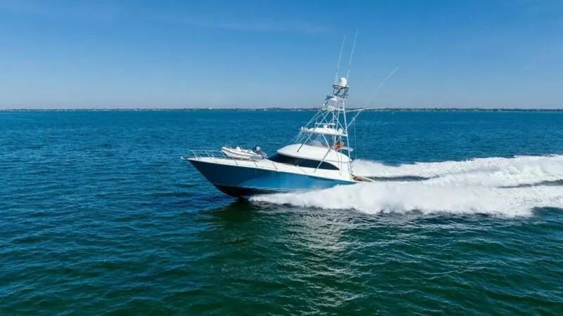 Slide: The Image of Viking 55 Convertible at Sea The 2013 Viking 55 Convertible, 'Hot Spot', cuts through the water with elegance and power. Its sleek hull design and prominent tower showcase Viking's commitment to superior craftsmanship and performance. The vessel's dynamic presence is complemented by - 7594311