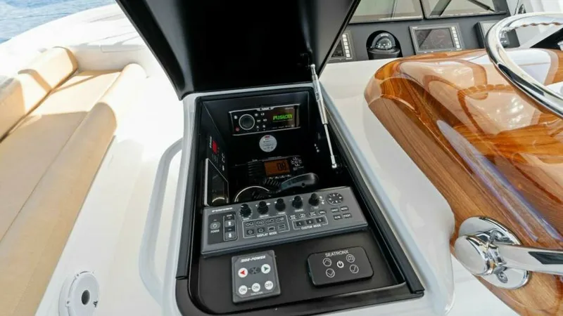 Slide: The Image of Helm Electronics Console The helm of the Viking 55 Convertible features an advanced electronics console, neatly integrated into the sleek design. The console includes state-of-the-art navigation and communication systems for seamless maritime operations. The polished wood trim an - 7594277