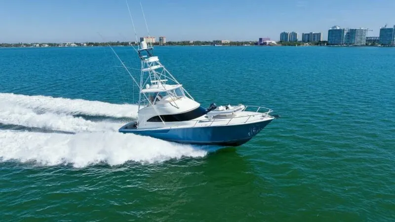 Slide: The Image of Viking 55 Convertible in Motion The 2013 Viking 55 Convertible 'Hot Spot' showcases its sleek design and powerful performance as it glides effortlessly across open waters. The vessel's aerodynamic lines and robust tower are prominent, emphasizing its sportfishing capabilities. This imag - 7594309