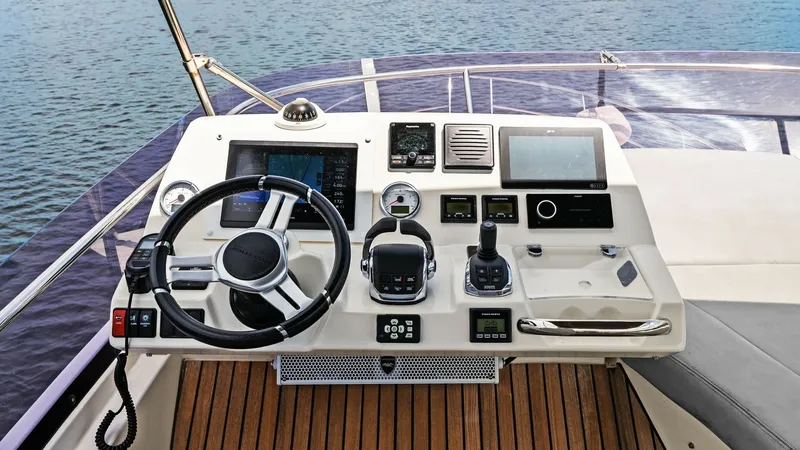 Slide: The Image of Flybridge Helm Station The flybridge helm station of the 2015 Prestige 500 Fly offers a commanding view with state-of-the-art navigation equipment. The ergonomic layout features a sleek steering wheel, advanced controls, and multiple digital displays for optimal control and con - 7603760