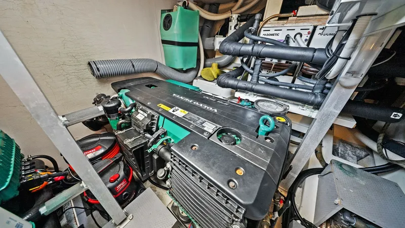 Slide: The Image of Engine Room with Volvo Penta Engine This image showcases the engine room of the 2015 Prestige 500 Fly, featuring a robust Volvo Penta engine. The well-organized layout ensures easy access to essential components for maintenance and inspections. The clean and efficient design highlights the - 7603819