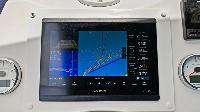 Slide: The Image of Helm Station with Navigation Display The helm station of the 2015 Prestige 500 Fly features an advanced Garmin navigation system, providing precise chart plotting and essential sailing metrics. Flanked by clear analog gauges, the display offers real-time information, ensuring a well-informed - 7603762