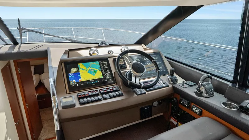 Slide: The Image of Flybridge Helm Station The helm station on the Prestige 500 Fly offers a commanding view with its advanced navigation system and ergonomic controls. The sleek dashboard features dual multifunction displays, providing essential data at your fingertips. The comfortable seating an - 7603790