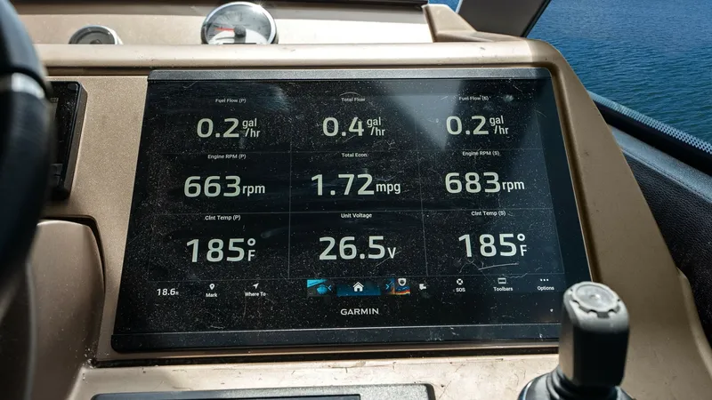 Slide: The Image of Flybridge Helm with Digital Display The Flybridge helm of the 2015 Prestige 500 Fly features a sophisticated Garmin digital display, providing comprehensive navigation and performance metrics. With clear readings on fuel efficiency, engine RPM, and temperature, the console ensures precise c - 7603792