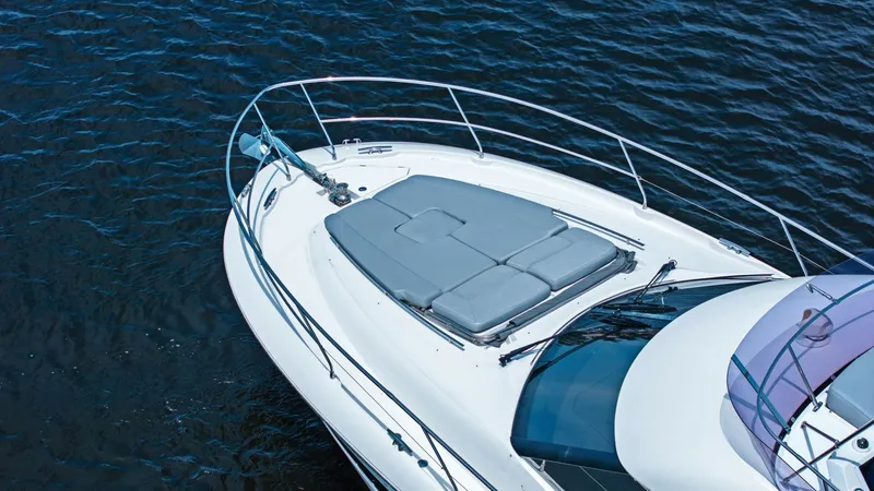 Slide: The Image of Spacious Foredeck with Sun Pads The Prestige 500 Fly features a sleek foredeck equipped with luxurious sun pads, perfect for relaxation and sunbathing. The stainless-steel railings provide safety and elegance, while the expansive view of the water enhances the sense of openness. This ar - 7603837