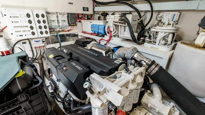 Slide: The Image of 2017 Cruisers 60 Cantius, 'Rising Star' - Engine Room with Volvo Penta IPS 950 Main Engine The engine room of the 2017 Cruisers 60 Cantius features powerful IPS 950 engines, showcasing advanced engineering and efficient layout. This well-organized space includes state-of-the-art control panels and meticulously arranged wiring for optimal perfor - 7603868