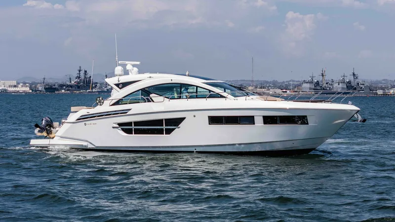 Slide: The Image of 2017 Cruisers 60 Cantius, 'Rising Star' The sleek and modern profile of the 2017 Cruisers 60 Cantius is captured in this side view. With its distinctive lines and expansive windows, the yacht offers a perfect blend of luxury and performance. The spacious layout is ideal for both entertaining an - 7603892