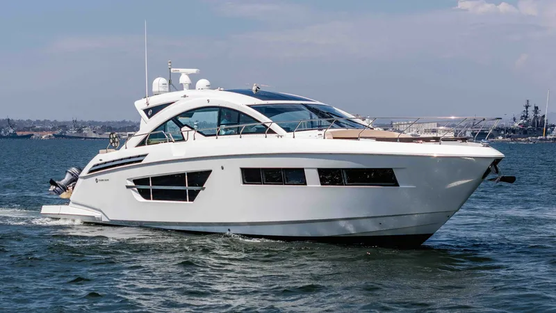 Slide: The Image of 2017 Cruisers 60 Cantius, 'Rising Star' The 2017 Cruisers 60 Cantius, 'Rising Star', is shown cruising gracefully on open waters. Its sleek and modern design features expansive windows that enhance natural light and provide stunning panoramic views. The aerodynamic hardtop and stylish lines con - 7603891