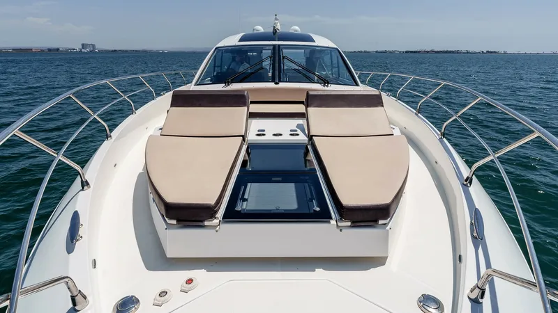 Slide: The Image of 2017 Cruisers 60 Cantius, 'Rising Star' - Spacious Bow with Sunpads The bow of the 2017 Cruisers 60 Cantius 'Rising Star' features luxurious sunpads for ultimate relaxation. The sleek design is complemented by a central skylight, providing natural light to the interior spaces below. Stainless steel railings and expansive - 7603881