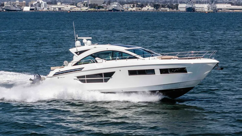 Slide: The Image of 2017 Cruisers 60 Cantius, 'Rising Star' The 2017 Cruisers 60 Cantius 'Rising Star' showcases a sleek and modern design as it glides effortlessly across the water. The elegant side profile highlights the expansive windows and aerodynamic lines that enhance both aesthetic appeal and performance. - 7603893