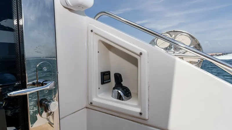 Slide: The Image of 2017 Cruisers 60 Cantius, 'Rising Star' - Cockpit Control Station This image showcases the cockpit control station on the Cruisers 60 Cantius. The sleek design integrates a joystick for easy maneuverability and precision handling. The stainless steel accents and ergonomic placement provide a modern touch, enhancing the - 7603878