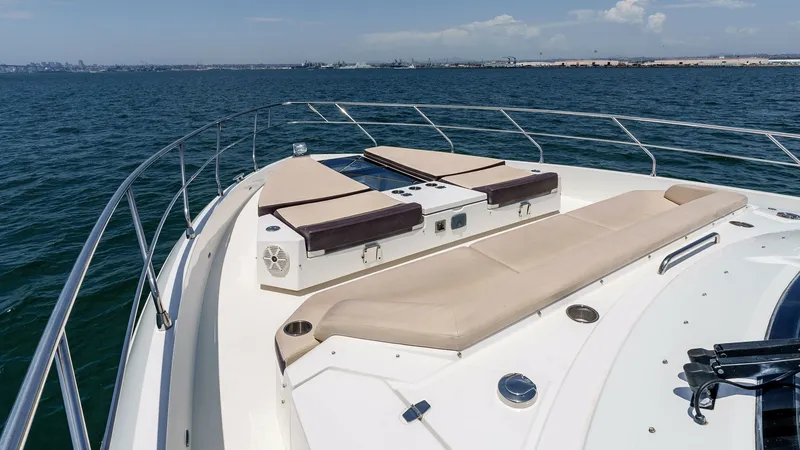 Slide: The Image of 2017 Cruisers 60 Cantius, 'Rising Star' - Spacious Bow Lounge Area The bow of the 2017 Cruisers 60 Cantius 'Rising Star' features an inviting sunbathing area with luxurious tan cushions. The sleek design is complemented by stainless steel railings, offering both safety and style. This space is perfect for relaxing under - 7603880