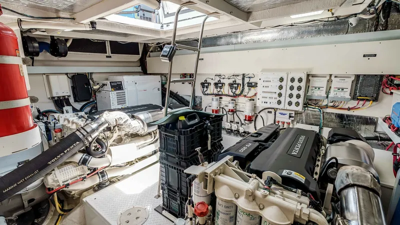 Slide: The Image of 2017 Cruisers 60 Cantius 'Rising Star' - Engine Room with Twin Volvo Penta Diesel Propulsion Engines The engine room of the 2017 Cruisers 60 Cantius, 'Rising Star', showcases powerful Volvo Penta engines, meticulously organized for optimal performance. The space is well-lit and features advanced control systems and wiring, ensuring efficient and reliable - 7603867