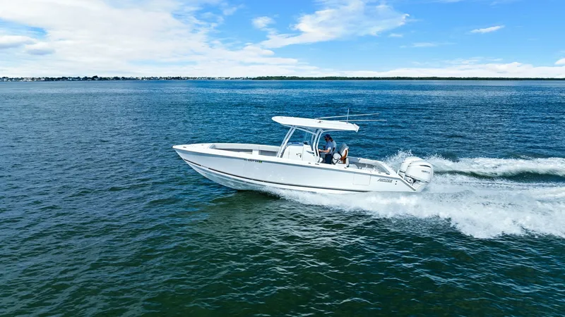 Slide: The Image of Jupiter 30 HFS in Motion The Jupiter 30 HFS is seen gracefully gliding over the water, showcasing its sleek hull design and powerful outboard engines. The vessel's T-top provides ample shade, while the spacious deck layout ensures comfort and versatility for both fishing and leis - 7718751