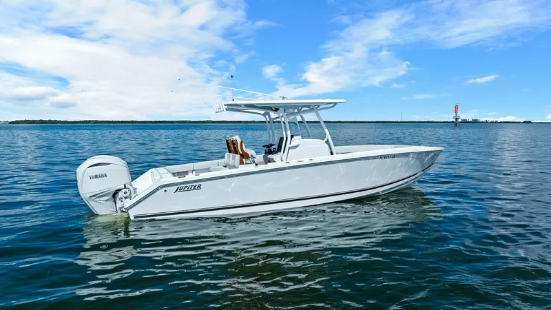 Slide: The Image of Side Profile on Open Water The 2025 Jupiter 30 HFS showcases its sleek design and powerful presence in this side profile view. With a robust T-top and dual Yamaha engines, this vessel is crafted for performance and style. The spacious deck layout and contemporary finishes make it i - 7718747