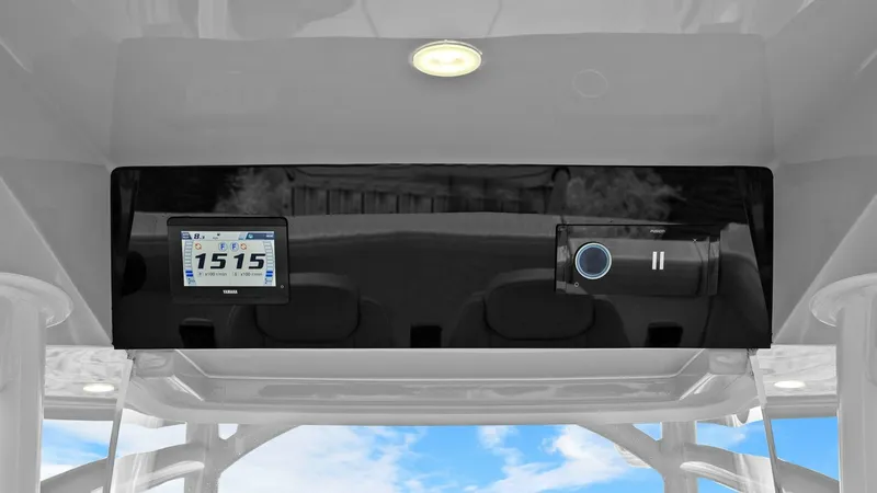 Slide: The Image of Helm Console Electronics Display The Jupiter 30 HFS helm console features a sleek, modern electronics display, seamlessly integrated for optimal functionality. The console includes a digital screen displaying vital navigation data, set against a glossy black panel for a sophisticated loo - 7718741