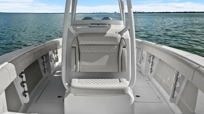 Slide: The Image of Spacious Bow Seating Area The bow of the 2025 Jupiter 30 HFS offers ample seating with plush, diamond-stitched upholstery, providing comfort and style. The wrap-around seating layout maximizes space for socializing or relaxing while enjoying the open water views. Durable materials - 7718727