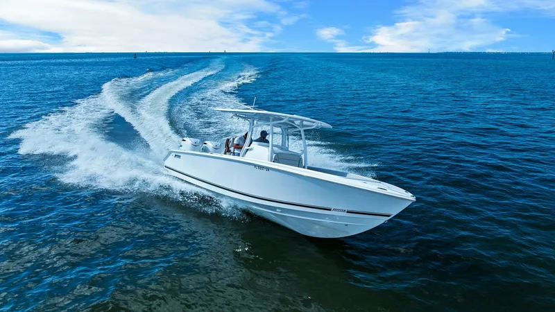 Slide: The Image of Dynamic Bow View in Motion The 2025 Jupiter 30 HFS cuts through the water with elegance and power, showcasing its sleek bow design. This image captures the vessel's impressive speed and agility, highlighted by the crisp wake trailing behind. The T-top provides a stylish silhouette - 7718756