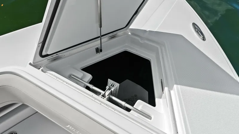 Slide: The Image of Anchor Locker on Foredeck The image showcases the anchor locker on the foredeck of the 2025 Jupiter 30 HFS. Featuring a spacious and well-constructed compartment, this locker provides easy access and secure storage for the anchor and related equipment. The sleek design and durable - 7718731