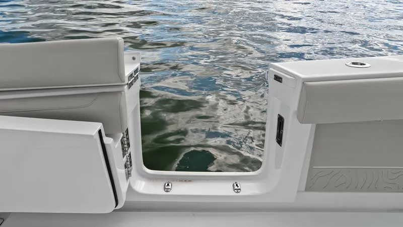 Slide: The Image of Transom Door with Water Access This image showcases the sleek transom door of the 2025 Jupiter 30 HFS, providing seamless access to the water. The door's robust construction ensures durability while its design integrates elegantly with the vessel's aesthetic. Perfect for easy boarding - 7718740