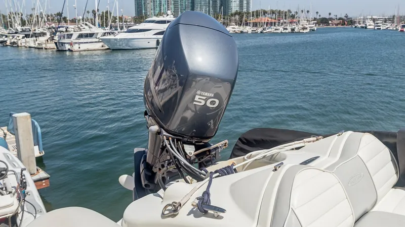 Slide: The Image of Yamaha Outboard on Aft Deck The image showcases a powerful Yamaha 50 outboard motor mounted on the aft deck of the Meridian 540 Pilothouse. This setup provides excellent maneuverability and performance for tender operations. The surrounding marina view enhances the appeal, highlight - 7721624