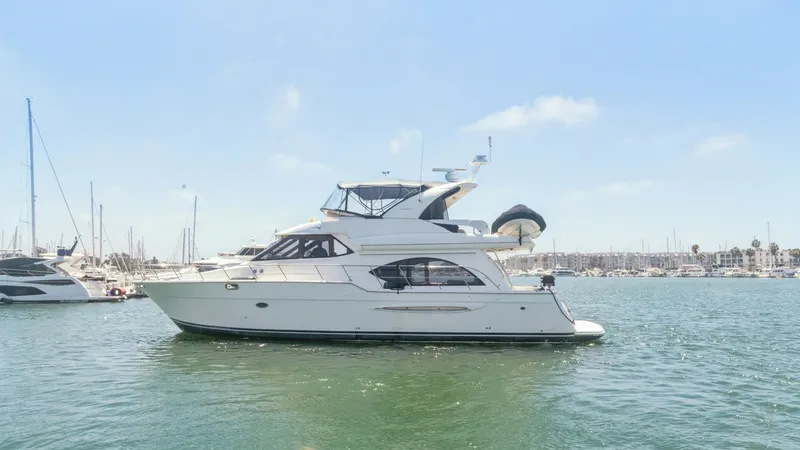 Slide: The Image of Portside View of Meridian 540 Pilothouse The 2005 Meridian 540 Pilothouse displays a sleek and elegant portside profile, highlighting its spacious flybridge and stylish design. The vessel's classic lines and expansive windows promise abundant natural light and stunning panoramic views. With its - 7721589