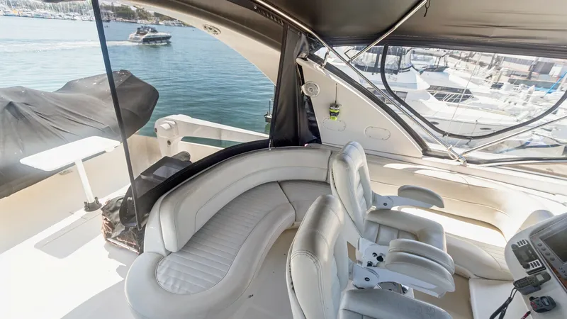 Slide: The Image of Flybridge Helm and Seating Area The flybridge of the 2005 Meridian 540 Pilothouse offers a spacious helm with dual captain's chairs for optimal navigation. Adjacent is a curved seating area, perfect for socializing while enjoying panoramic views. The area is sheltered by a sleek canopy, - 7721618