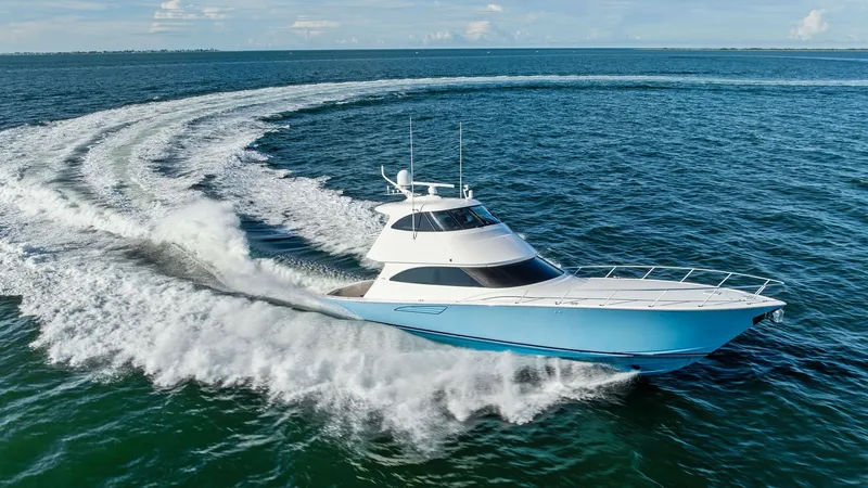 Slide: The Image of Viking 62 Enclosed Bridge in Action The 2018 Viking 62 Enclosed Bridge, 'Joan's Boys', showcases its sleek design and powerful performance as it cuts through the water. The dynamic hull and advanced engineering provide a smooth and exhilarating ride. This vessel's striking blue exterior and - 7751318