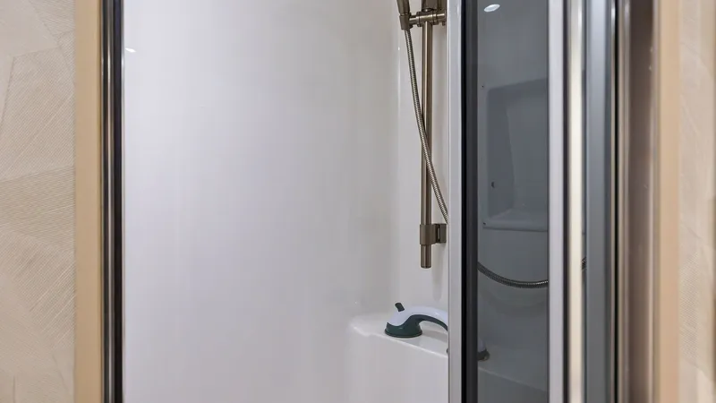 Slide: The Image of Modern Enclosed Shower Stall This sleek and modern enclosed shower stall on the Viking 62 Enclosed Bridge offers a clean and sophisticated design. Featuring high-quality fixtures and a spacious interior, it provides comfort and convenience with easy-to-clean surfaces. The glass door - 7751265