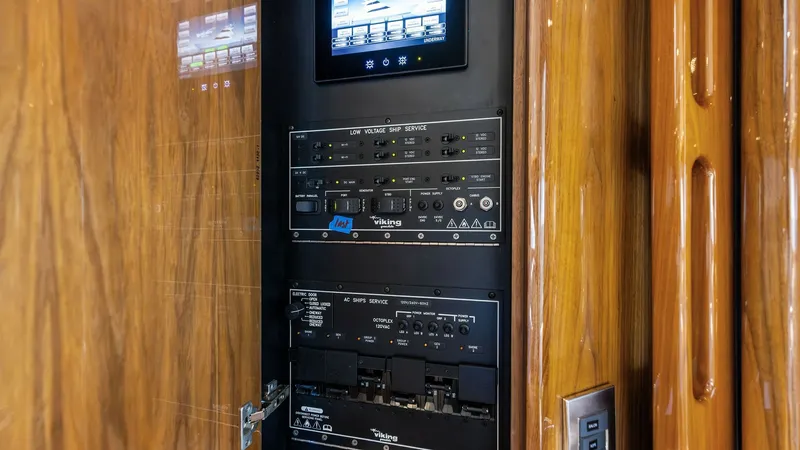 Slide: The Image of Electrical Control Panel This image showcases the sophisticated electrical control panel of the Viking 62 Enclosed Bridge, featuring advanced systems management for seamless operation. The sleek touchscreen interface allows for easy navigation and monitoring, while the high-quali - 7751234