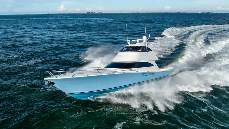 Slide: The Image of Viking 62 Enclosed Bridge at Sea The Viking 62 Enclosed Bridge cuts through the waves with its sleek hull and aerodynamic profile. This 2018 model, 'Joan's Boys,' showcases a robust design paired with elegant lines, perfect for both fishing adventures and luxurious cruising. Its powerful - 7751319