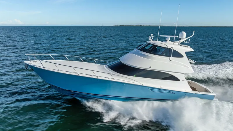 Slide: The Image of Viking 62 Enclosed Bridge in Motion This image showcases the sleek profile of the 2018 Viking 62 Enclosed Bridge, cutting through the water with impressive speed and elegance. The vessel's aerodynamic design and polished finish highlight its superior craftsmanship, while the enclosed bridge - 7751317