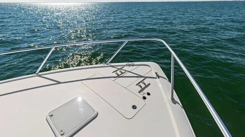 Slide: The Image of Foredeck with Stainless Steel Rails The foredeck of the 2018 Viking 62 Enclosed Bridge features sleek stainless steel rails, providing both style and safety. The spacious layout offers ample room for sunbathing or enjoying panoramic views of the open water. The clean, modern design compleme - 7751287