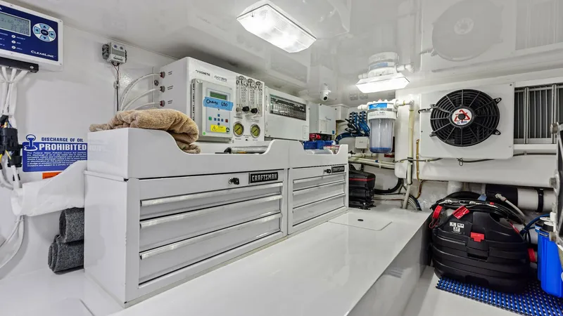 Slide: The Image of Engine Room with Tool Storage The engine room of the 2018 Viking 62 Enclosed Bridge 'Joan's Boys' is equipped with meticulously organized tool storage, enhancing maintenance efficiency. The space is well-lit and features advanced mechanical systems for optimal vessel performance. High - 7751294