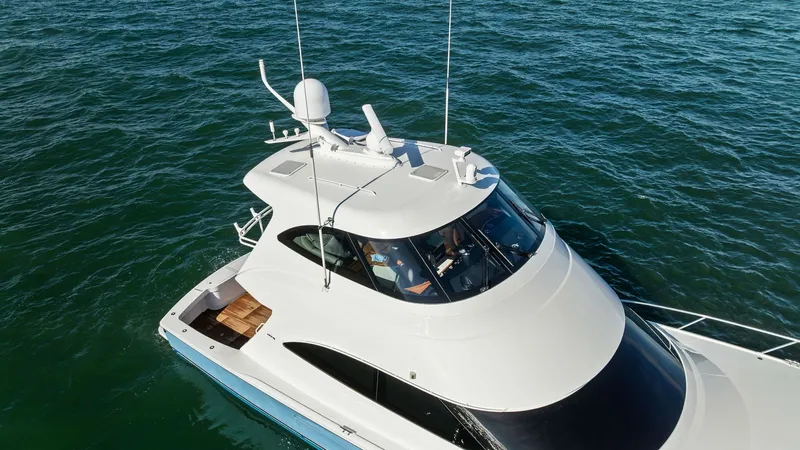 Slide: The Image of Enclosed Bridge and Upper Deck This image showcases the sleek enclosed bridge of the 2018 Viking 62 Enclosed Bridge, 'Joan's Boys'. The streamlined design features expansive windows, offering panoramic views and ample natural light. The upper deck is equipped with advanced navigation a - 7751312