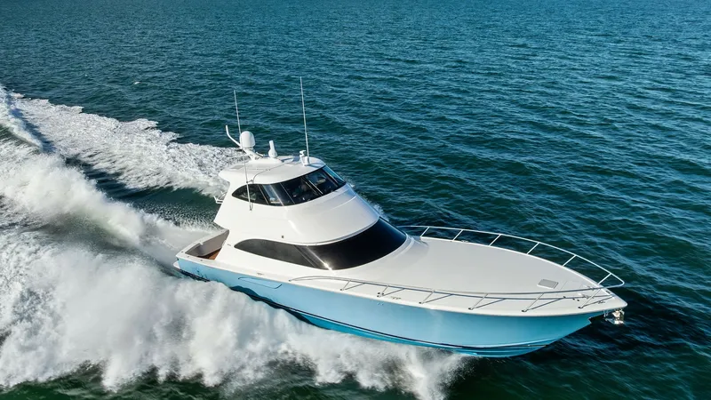 Slide: The Image of Dynamic Aerial View of Enclosed Bridge This striking aerial shot showcases the Viking 62 Enclosed Bridge cutting through the water with precision. The sleek, aerodynamic design enhances both performance and aesthetics, while the expansive foredeck offers ample space and a clean, sophisticated - 7751314
