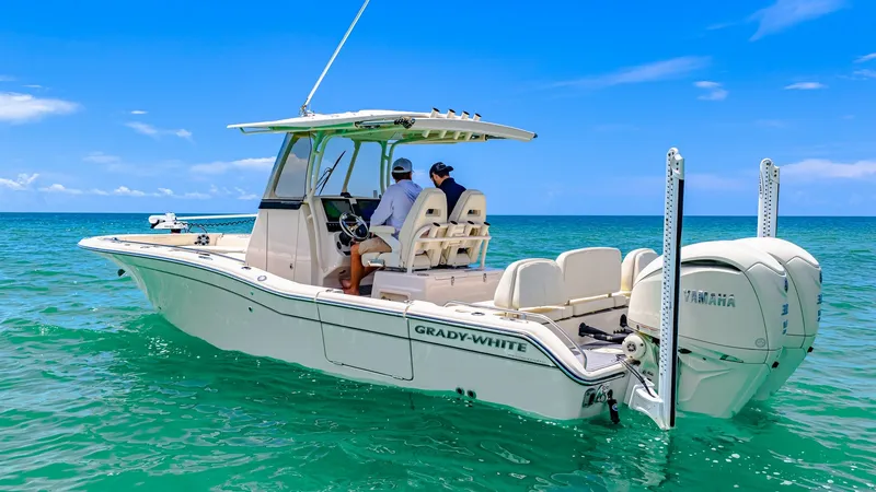 Slide: The Image of Aft View of Grady-White 281 CE The 2024 Grady-White 281 CE showcases a sleek aft design with dual Yamaha outboard engines, offering exceptional power and performance. The spacious cockpit features comfortable seating and a well-equipped helm station, perfect for both leisure cruising a - 7766851