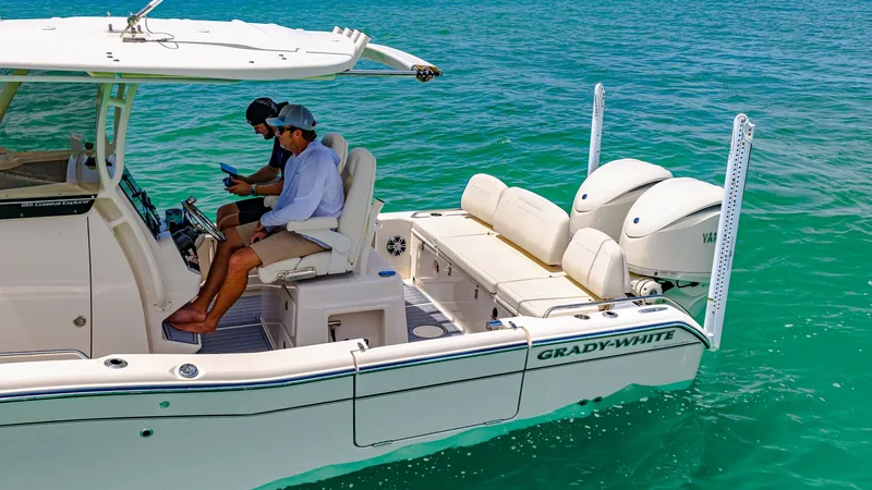 Slide: The Image of Cockpit and Twin Outboards The 2024 Grady-White 281 CE showcases a spacious cockpit area with comfortable seating for navigation and relaxation. The dual helm seats offer excellent visibility and ergonomic control, while the twin Yamaha outboards promise powerful performance. This - 7766849