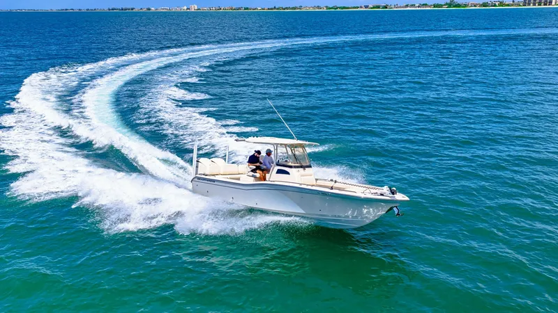 Slide: The Image of Grady-White 281 CE in Action Experience the thrill of the 2024 Grady-White 281 CE as it effortlessly glides over the water. This dynamic boat showcases its sleek design and powerful performance, perfect for both leisure cruising and adventurous outings. The spacious deck and comforta - 7766903