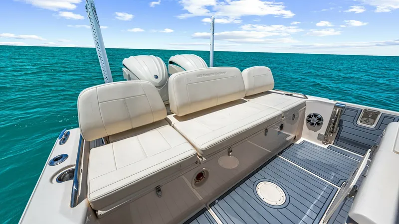 Slide: The Image of Spacious Aft Deck with Seating The 2024 Grady-White 281 CE features a well-appointed aft deck, complete with plush, foldable seating that offers comfort and flexibility. The deck is elegantly finished with non-slip flooring, ensuring safety and style. This area is perfect for socializi - 7766872