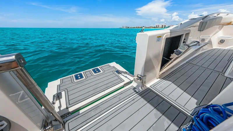 Slide: The Image of Spacious Swim Platform The 2024 Grady-White 281 CE features an expansive swim platform, offering easy access to the water. The platform's durable, non-slip surface ensures safety and comfort, while sleek stainless steel accents add a touch of elegance. This area is perfect for - 7766879